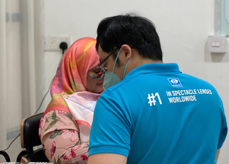 An optometrist performs a subjective refraction